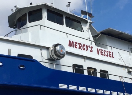 The name MERCY'S VESSEL lettered on the white superstructure of the ship.